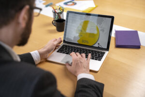 A man analysing traffic growth on the laptop