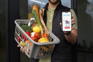 Grocery store marketing- A man showcasing online delivery