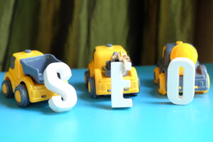 SEO for automotive industry:Arranged SEO leetrs infront of cars